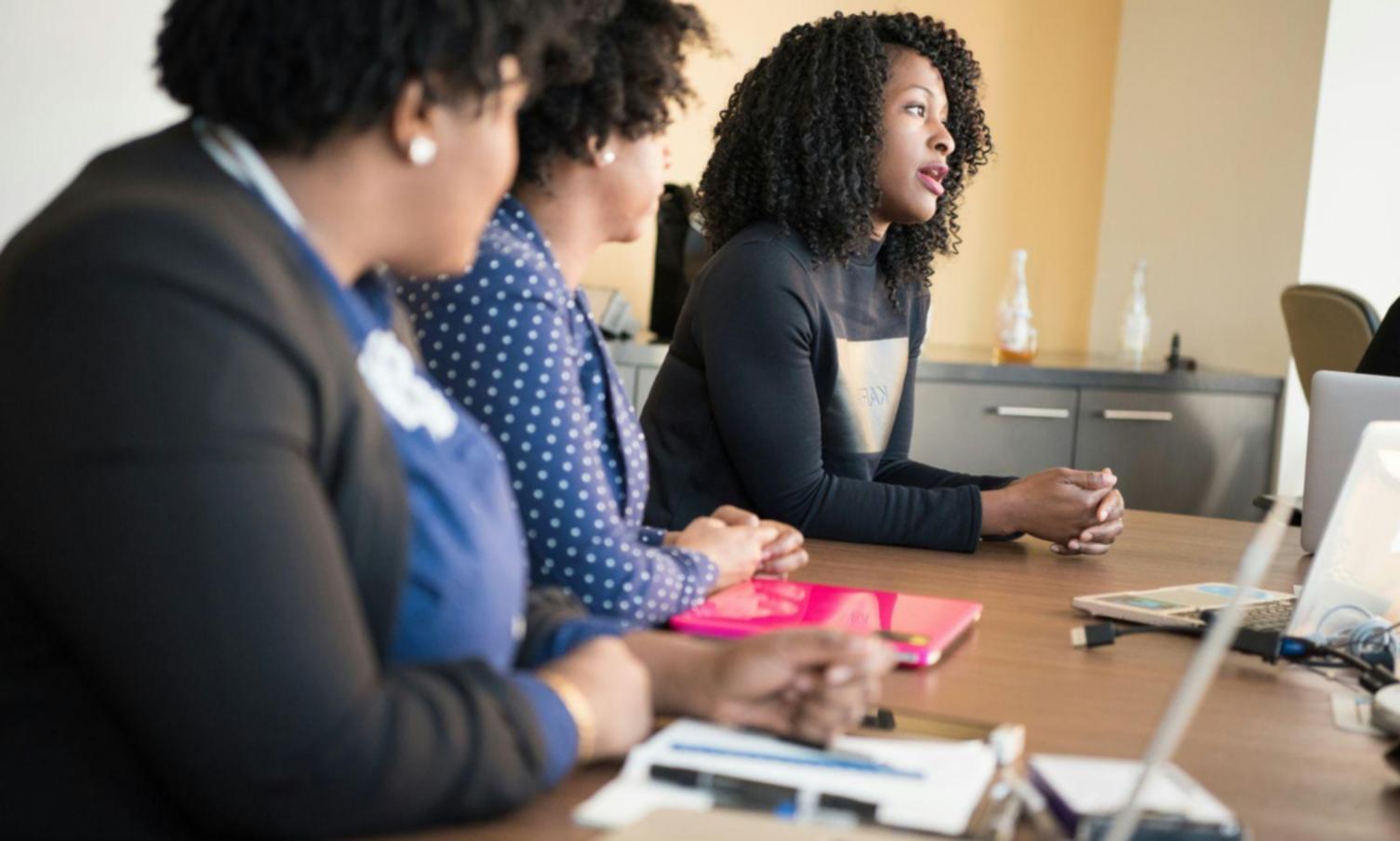 Professional business forecasting workshop session with participants analyzing financial data